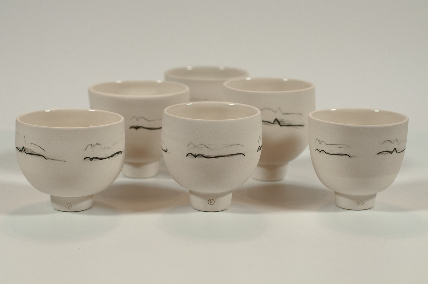 Small Canadian-made porcelain tea cup, 6 oz, hand-thrown and polished, featuring hand-drawn Pewee soundwave